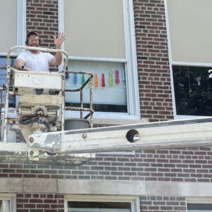 Mr. Green working on School Windows